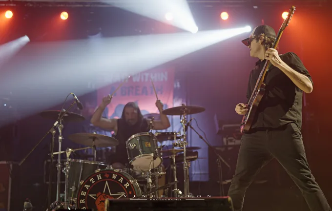 Bassist and drummer performing together