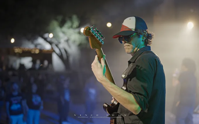 Bassist seen from the side of the stage
