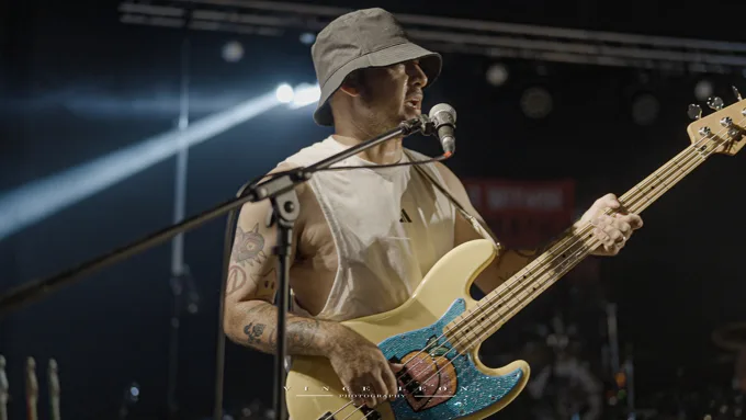 Close view of the bassist playing
